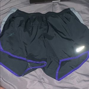 Gray and purple medium Nike dri-fit running shorts